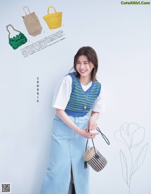 A woman wearing a striped sweater and a white skirt.
