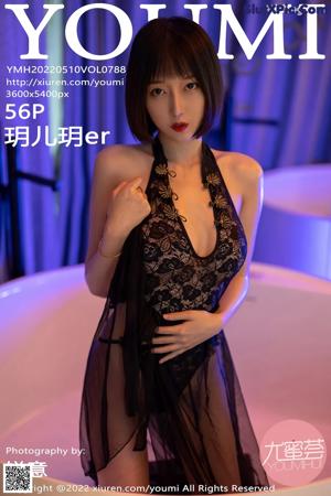 A woman in a black lingerie posing for a picture.