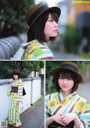 A woman in a kimono is standing on the street.